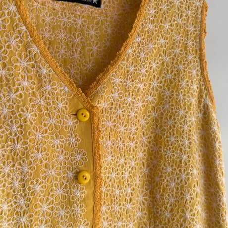 Yellow vest with flower embroidery