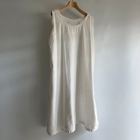 white cotton sleeveless one-piece