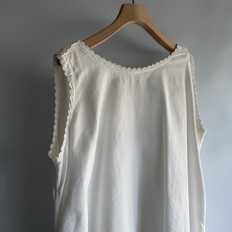 white cotton sleeveless one-piece