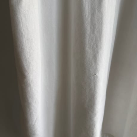 white cotton sleeveless one-piece