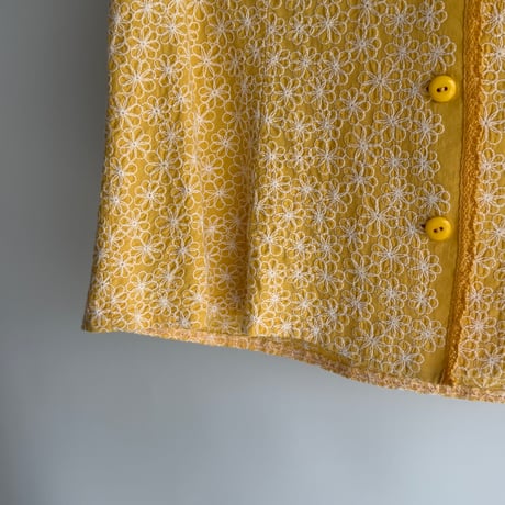Yellow vest with flower embroidery