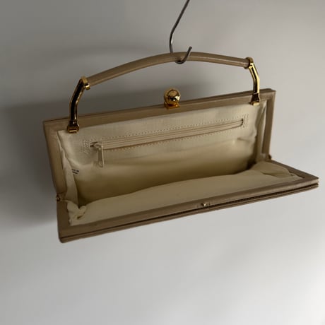 Embroidery beige clutch bag