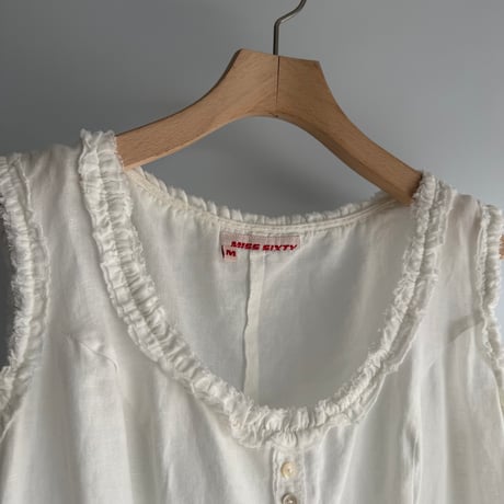 Frilled sleeveless tops