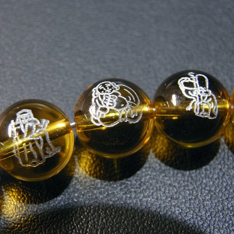 [beads409] 彫りビーズ・合成シトリン（七福神）10mm 7個セット