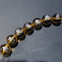[beads409] 彫りビーズ・合成シトリン（七福神）10mm 7個セット