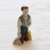 arabia fishing boy figurine