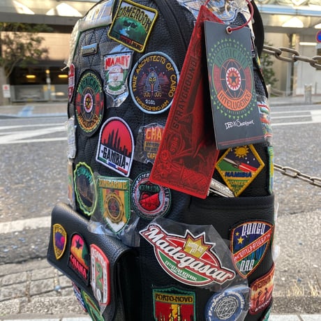 特別限定 SPRAYGROUND アフリカン インテリジェンス A.I. THE 54 PATCHES OF AFRICA カーゴバックパック