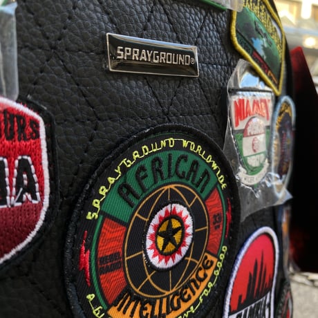 特別限定 SPRAYGROUND アフリカン インテリジェンス A.I. THE 54 PATCHES OF AFRICA カーゴバックパック