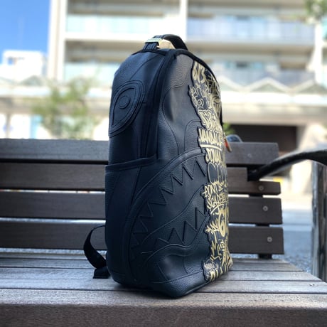 特別限定 SPRAYGROUND ハーフグラフィティ メタリック バックパック ビーガンレザー (BKPK69)