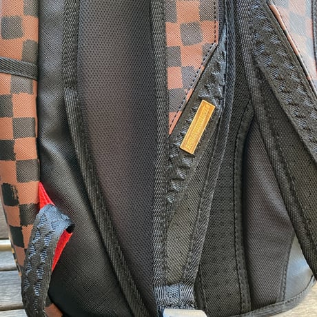 特別限定コラボ SPRAYGROUND スプレイグラウンド DIAA ALLAM ディアアラム アラビア書道 バックパック 茶 (BKPK75)