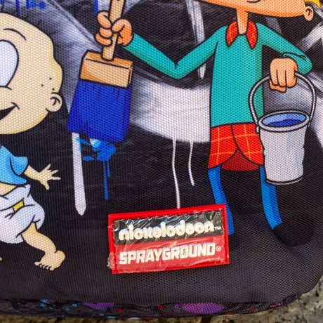 米国仕様 SPRAYGROUND ニコロデオン 90s Nick Toon テイクオーバー 落書き バックパック (BKPK8)