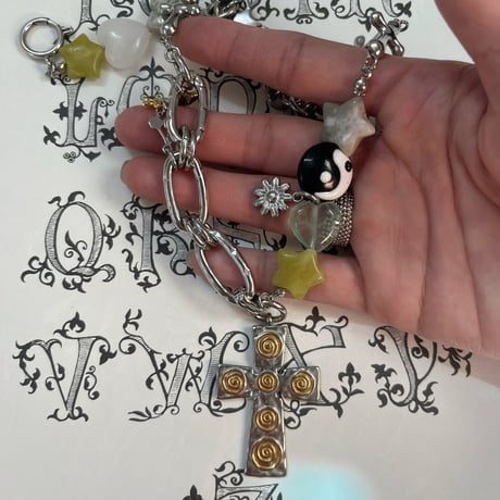 guru guru cross necklace