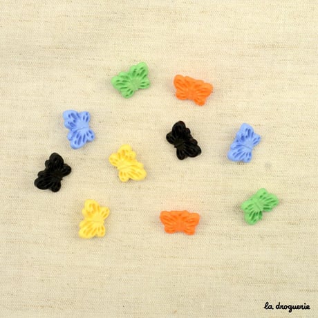 Bouton Envolée papillons ajourés 15 mm
