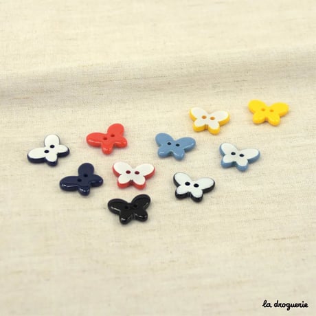 Bouton Stylisé papillon réversible 20 mm