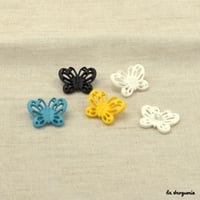 Bouton Envolée papillons ajourés 25 mm