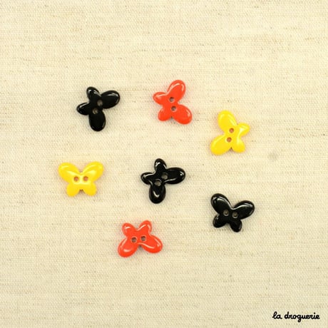 Bouton Stylisé papillon réversible 15 mm