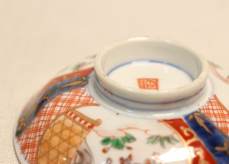 明治前期色絵梅と鶯に鳥籠図通り物飯茶碗