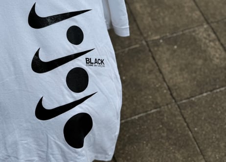 black comme des garcons nike logo polo shirt