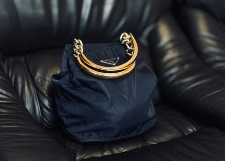 prada gold handle triangle logo bag