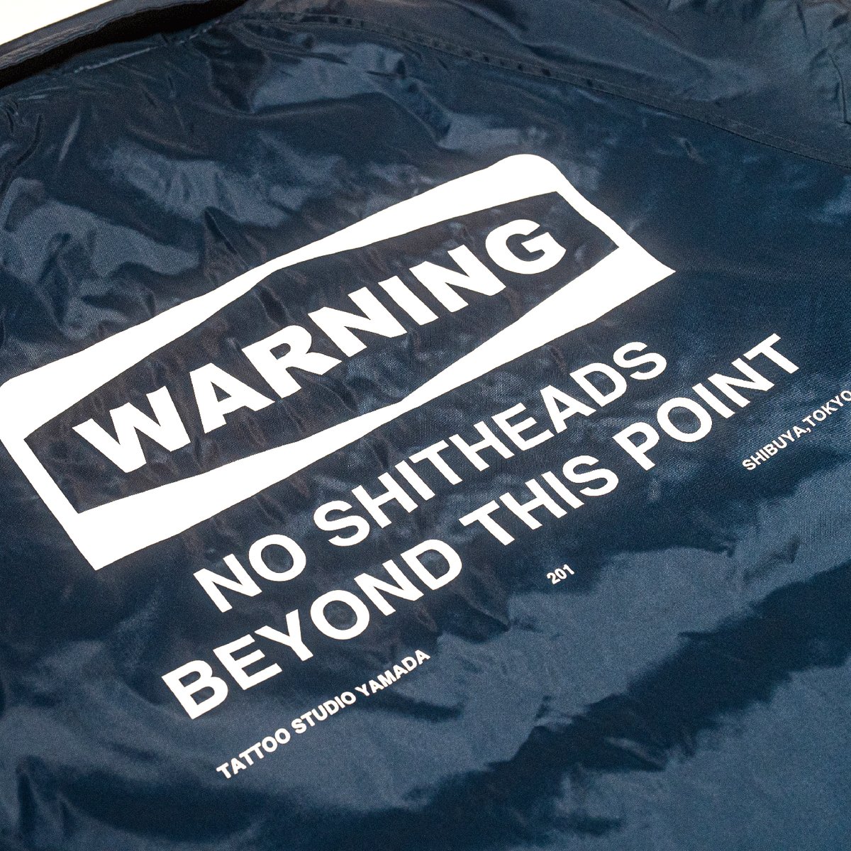 NYLON COACH JACKET【WARNING】// NAVY | tattoostud