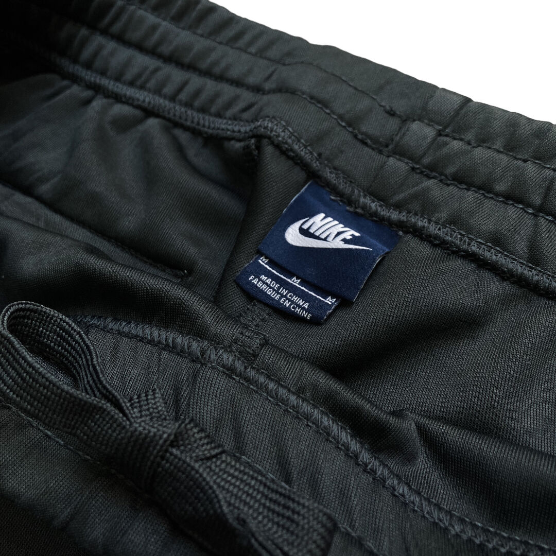 NIKE 90-00s piping line track pants | 無無