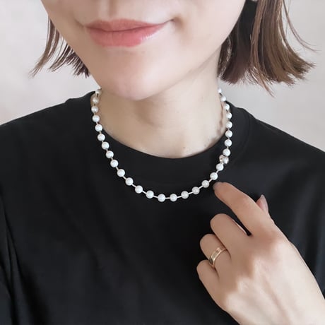 between petit pearls necklace