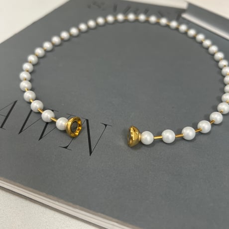 between petit pearls necklace