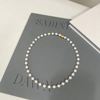 between petit pearls necklace