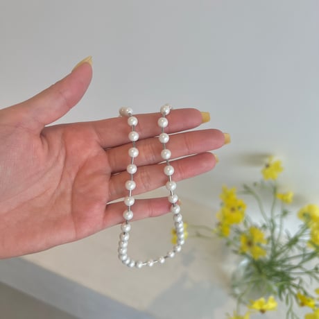 between petit pearls necklace