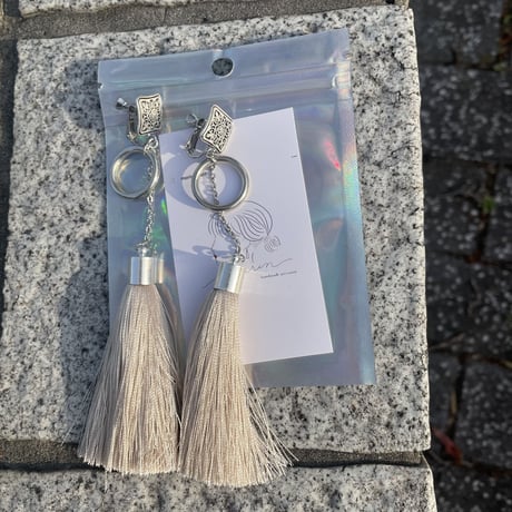 beige silver tassel