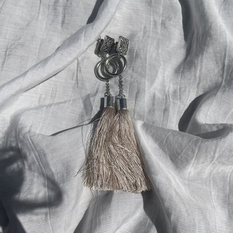 beige silver tassel