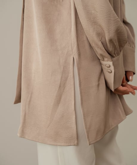 asymmetry embossed blouse beige