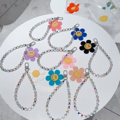 CUTECASE 笑顔の花 スマホストラップ キラキラ感 お洒落 バックチャーム キーホルダー iPhone、Xperia、AQUOS、Xiaomi、Galaxy 対応 CM6295