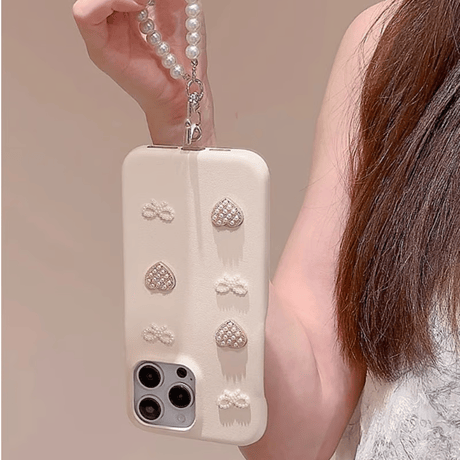 CUTECASE上品 iPhone16/16proケース パールリボン/ハート iPhone14/13pro/12ケース ベージュ色 チャーム付 レザー製CM4669