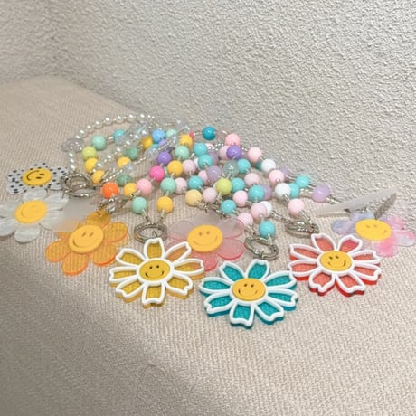 CUTECASE 笑顔の花 スマホストラップ キラキラ感 お洒落 バックチャーム キーホルダー iPhone、Xperia、AQUOS、Xiaomi、Galaxy 対応 CM6497