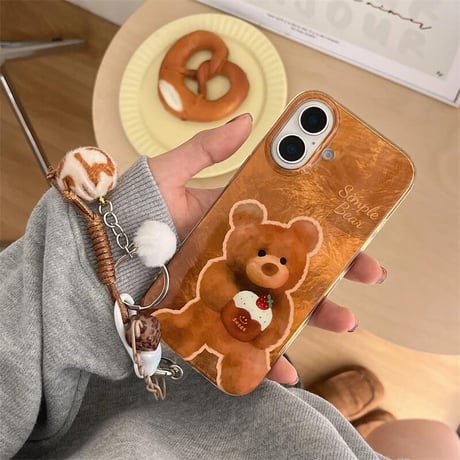 CUTECASE熊ちゃん iPhone16/16Proケース 光沢感 ブラウン アイフォン15プロ/14/13proカバー 毛玉ストラップ めっちゃ可愛い CM4820
