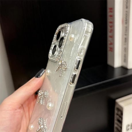 CUTECASE 女子力高いリボン iPhone16/17proケース パールデコ iPhone15promax/14pro/13 シェル風/キラキララメ ジュエリーカメラ枠CM5643