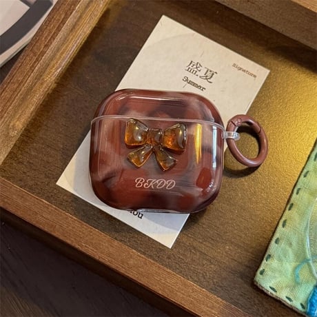 CUTECASE 琥珀調 Airpods4ケース リボンデコ エアポッズ3/Pro2ケース airpodspro2カバー リング付 シック ギフトにおすすめCM5520