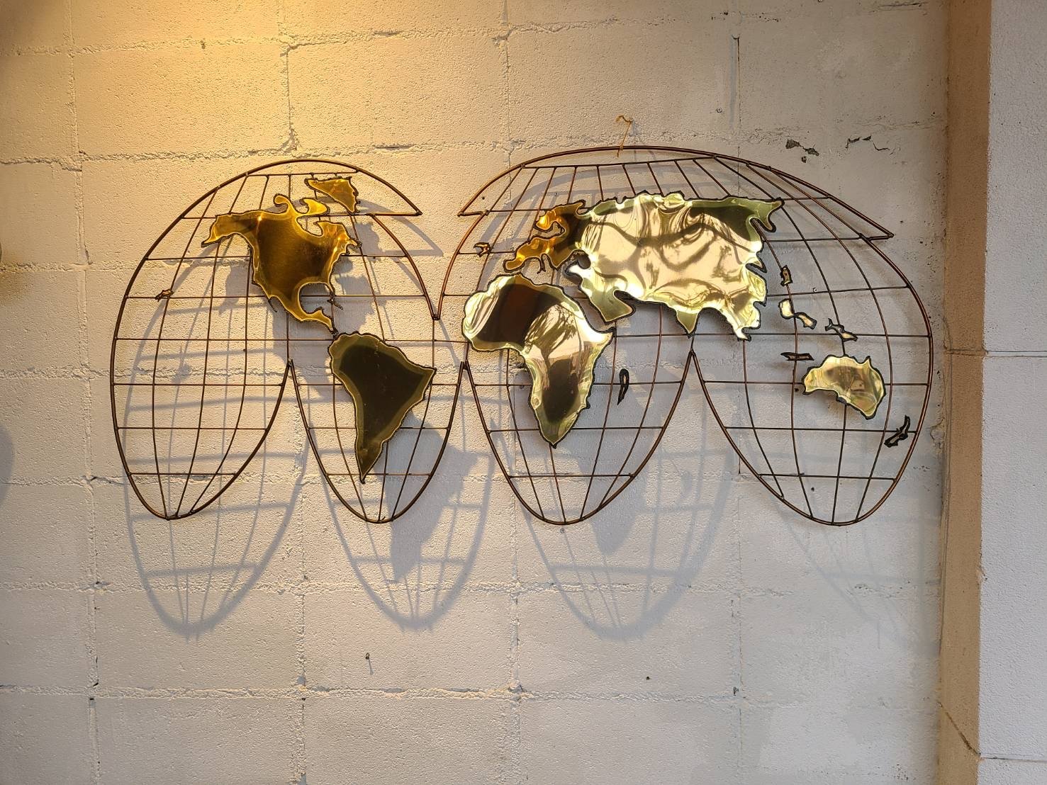 Curtis Jere wall sculpture globe | The NOON