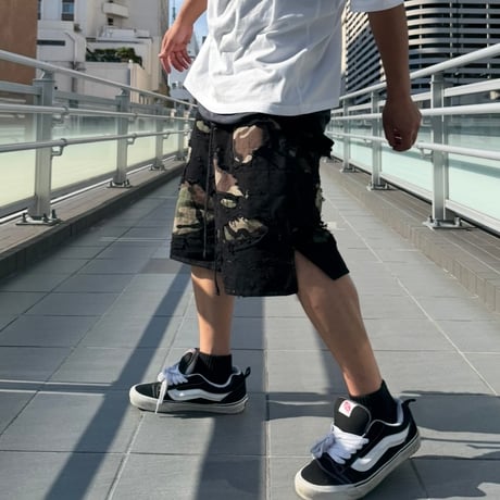 DISTRESSED CAMO SHORTS