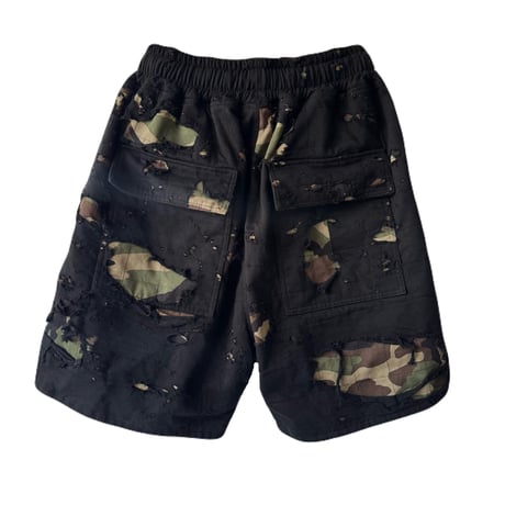 DISTRESSED CAMO SHORTS