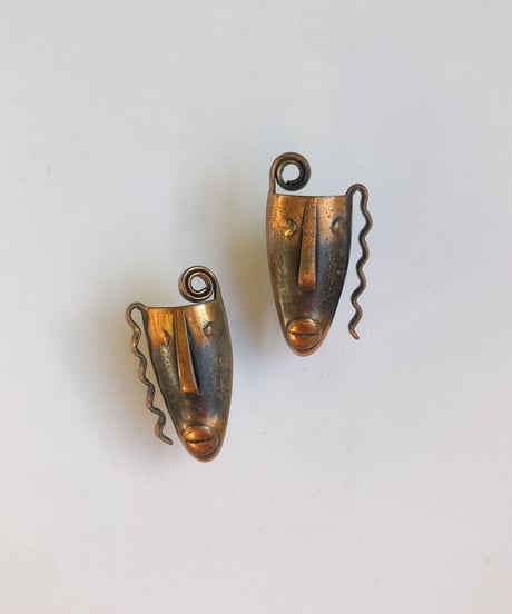 rabajes copper face earrings