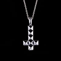 Anti studs cross charm