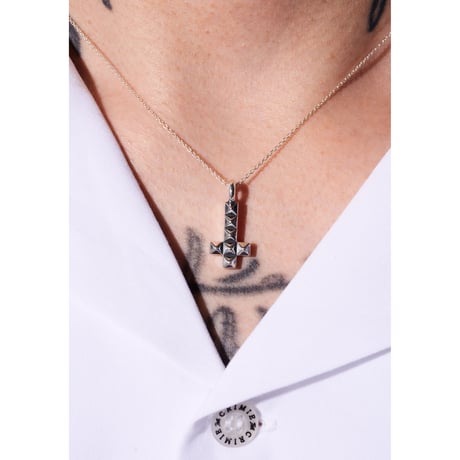 Anti studs cross charm