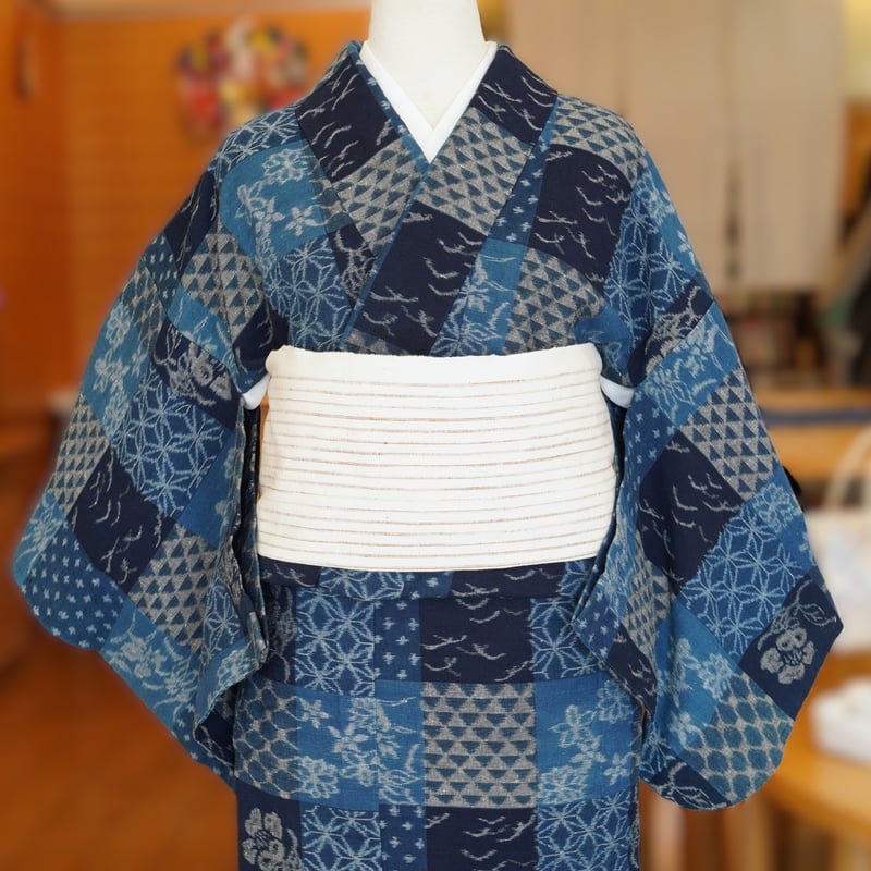 名古屋帯 未使用品 椿 つばき 雲 鉛丹色 綴じ糸 NO-440 九寸帯（名古屋帯）「手紡ぎ木綿・織工房いついろ・山下絵里
