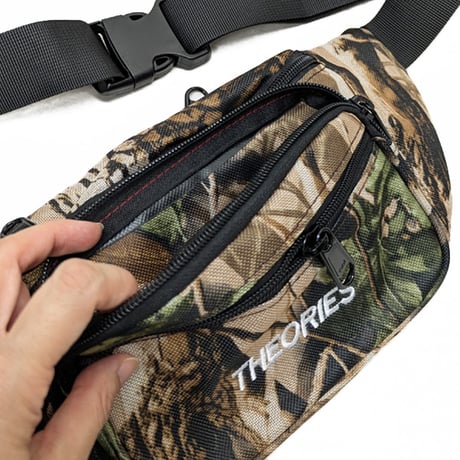 THEORIES バッグ　THEORIES SHOULDER BAG STAMP DAY PACK (REAL-TREE.CAMO)