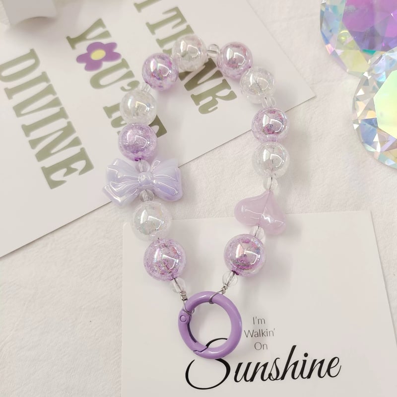 お取り寄せ商品】iPhone スマホアクセサリー ビーズ ハート リボン お取り寄せ商品】iPhone スマホアクセサリー ビーズ ハート リボン