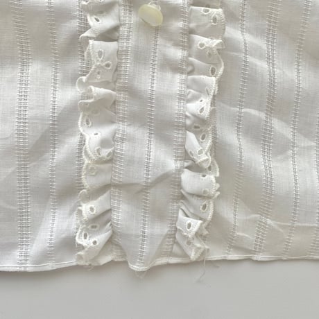 white frill designed shirt