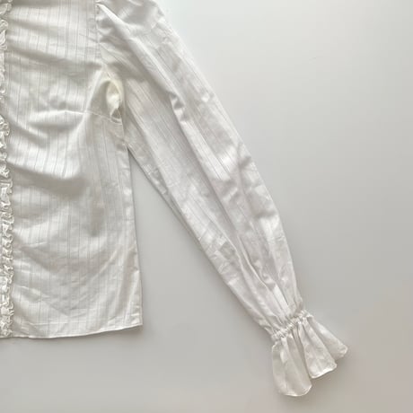white frill designed shirt