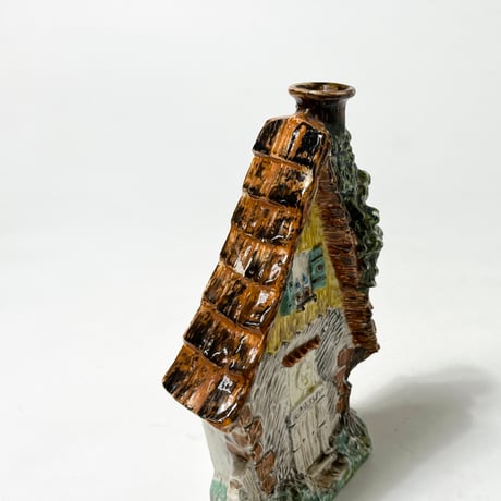 USED CERAMIC BRANDY BOTTLE